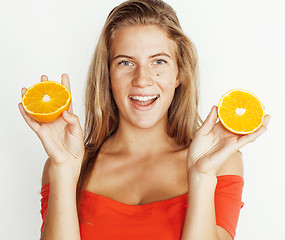 Image showing young pretty blond woman with half oranges close up isolated on white bright teenage smiling