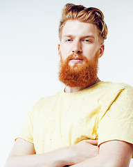 Image showing young handsome hipster ginger bearded guy looking brutal isolated on white background, lifestyle people concept