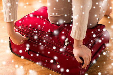 Image showing close up of woman packing travel bag for vacation