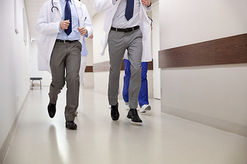 Image showing close up of medics or doctors running at hospital