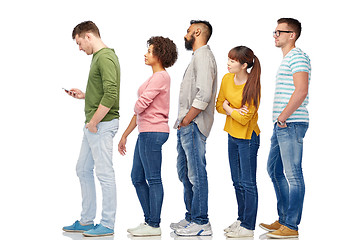 Image showing group of people in queue with smartphone