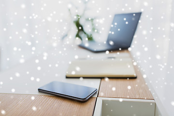 Image showing notebook, laptop and smartphone on office table