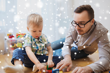 Image showing father and son playing with toy blocks at home