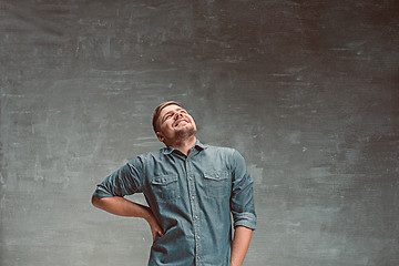 Image showing Portrait of smiling happy man standing in studio