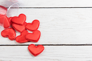 Image showing Red hearts on a white wood background