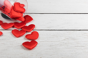 Image showing Red hearts on a white wood background