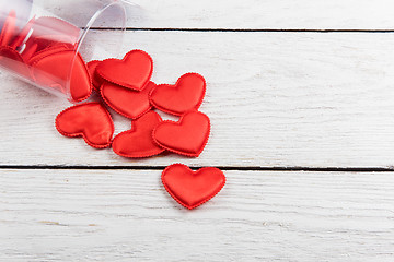 Image showing Red hearts on a white wood background