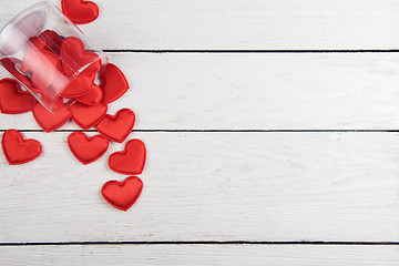 Image showing Red hearts on a white wood background