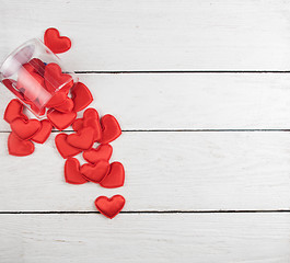 Image showing Red hearts on a white wood background