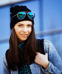 Image showing young pretty girl near business building walking, student in ame