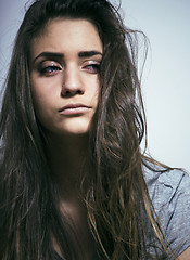 Image showing problem depressioned teenage with messed hair and sad face, junk