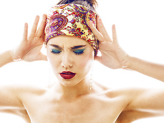 Image showing young pretty modern girl with bright shawl on head emotional posing isolated on white background, asian people ethnicity