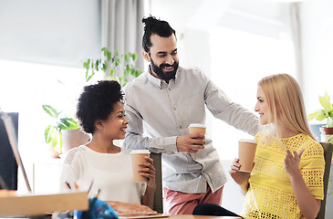 Image showing business team with coffee cups talking at office