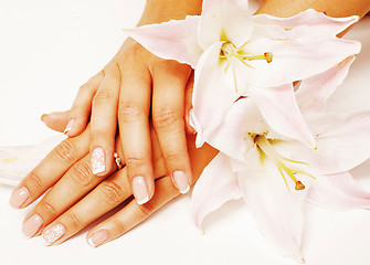 Image showing manicure pedicure with flower lily close up isolated on white pe