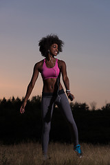 Image showing black woman is doing stretching exercise relaxing and warm up