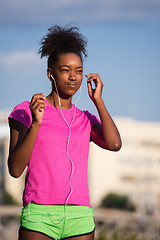 Image showing young african american woman running outdoors