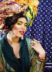 Image showing beauty bright woman with creative make up, many shawls on head l