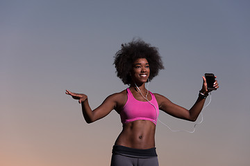 Image showing young black girl dances outdoors