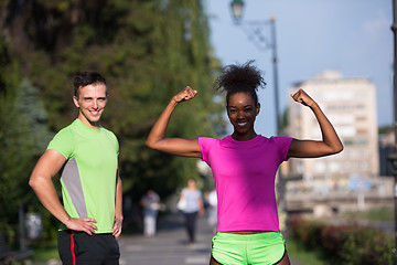 Image showing portrait of young multietnic jogging couple ready to run