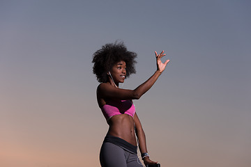 Image showing young black girl dances outdoors