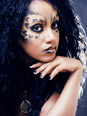 Image showing beauty afro girl with cat make up, creative leopard print