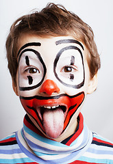 Image showing little cute real boy with facepaint like clown, pantomimic expre