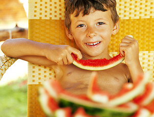 Image showing cute young little boy with watermelon crustes smiling