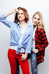 Image showing two pretty blond woman having fun together on white background, mature mother and young teenage daughter, lifestyle people concept