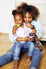 Image showing adorable sweet young afro-american mother with cute little daugh