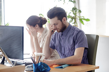 Image showing business team with computer and files in office