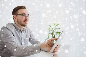 Image showing happy creative male office worker with tablet pc