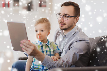 Image showing father and son with tablet pc playing at home