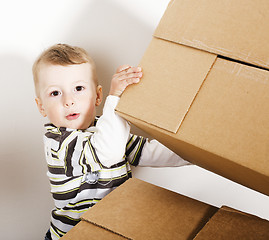 Image showing portrait of little cute boy playing with box, lifestyle people concept