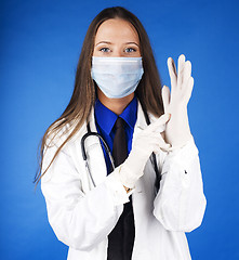 Image showing young pretty woman doctor with stethoscope wearing mask