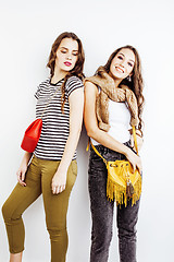 Image showing two best friends teenage girls together having fun, posing emotional on white background, besties happy smiling, lifestyle people concept