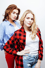 Image showing two pretty blond woman having fun together on white background, mature mother and young teenage daughter, lifestyle people concept