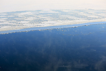 Image showing Background of Vaporizing, Freezing Blue Sea