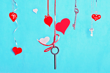 Image showing Keys And Hearts Against The Turquoise Background