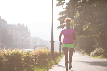 Image showing african american woman jogging in the city