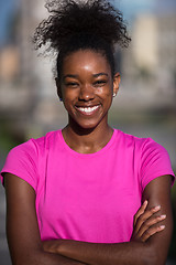 Image showing Portrait of sporty young african american woman running outdoors