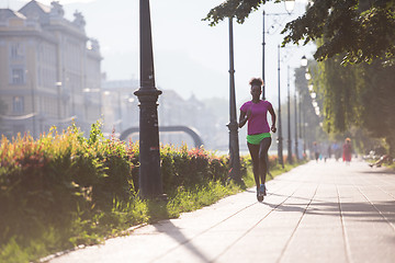 Image showing african american woman jogging in the city