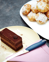 Image showing Chocolate cake and eclairs