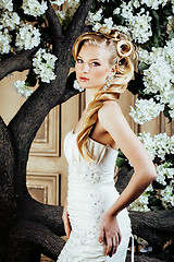 Image showing beauty young bride alone in luxury vintage interior with a lot of flowers close up