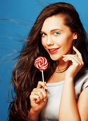 Image showing young pretty adorable woman with candy close up like doll