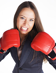 Image showing portrait of business woman boxing in red gloves. business activity