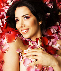 Image showing beauty young brunette woman with flower close up, rose petails spa