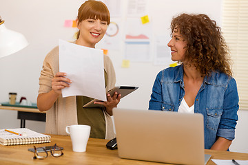 Image showing Two businesswoman working together