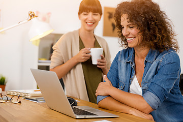 Image showing Two businesswoman working together