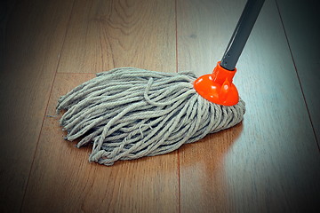 Image showing detail of wooden floor cleaning with mop