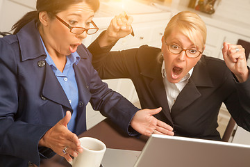 Image showing Businesswomen Celebrate Success on the Laptop